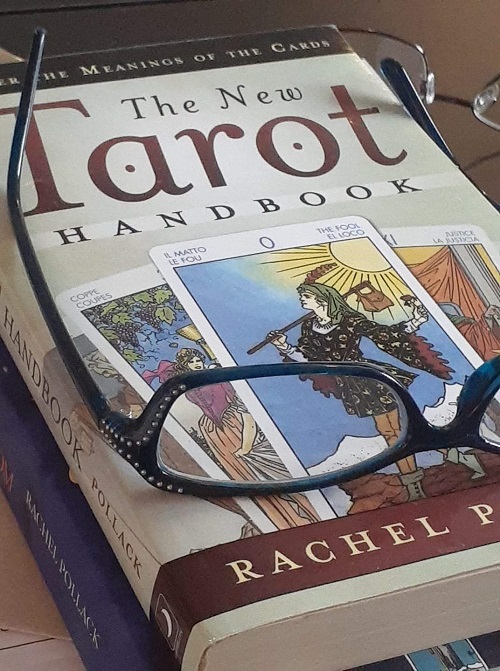 tarot book and glasses